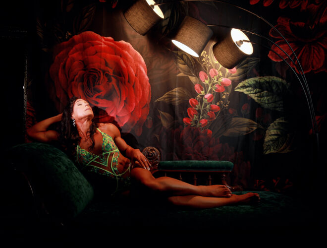 Woman in green lingerie on a vintage chaise beneath a rose mural, A Milestone Birthday Boudoir Session at My Story Boudoir Melbourne