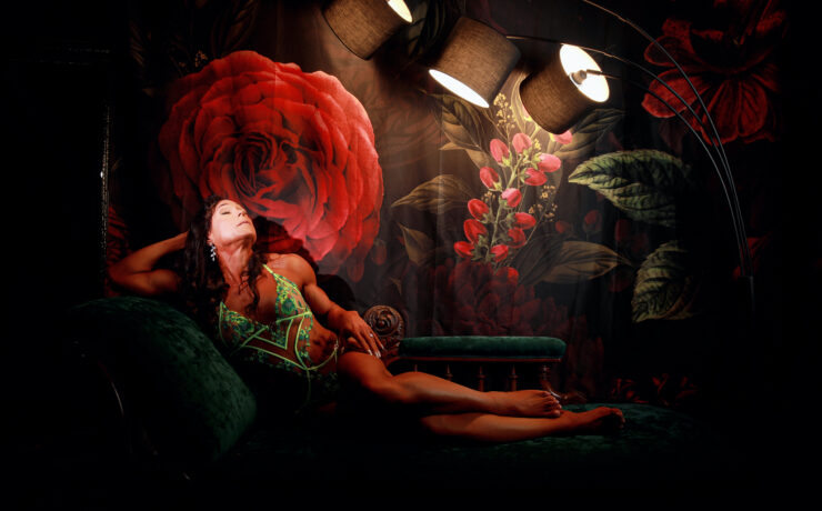 Woman in green lingerie on a vintage chaise beneath a rose mural, A Milestone Birthday Boudoir Session at My Story Boudoir Melbourne