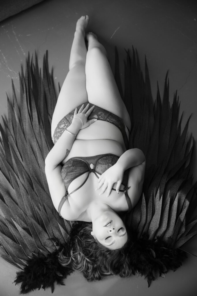 Boudoir client taking her time choosing images at a Footscray reveal appointment