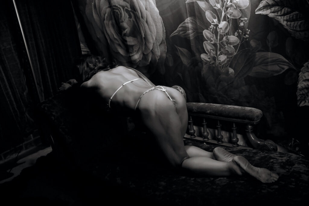 Woman in her fifties in soft lighting during a boudoir photography over 50 session in Footscray